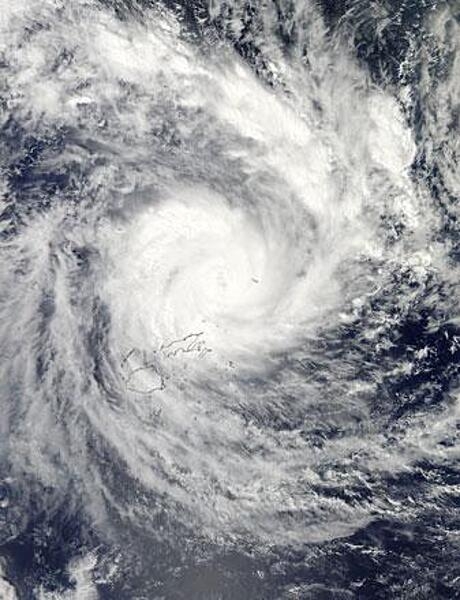 NASA&apos;s Aqua satellite passed over Tropical Cyclone Evan on 16 December 2012 and captured this true-color image of the intense storm over the island nation of Fiji. In this image, the storm contains a large, cloud-filled eye, which was estimated at about 17 km (11 mi) across. Heavy rain bands wrap in an apostrophe shape around the center, and reach over the two main islands of Fiji, Viti Levu (south) and Vanua Levu (north). Tropical Cyclone Evan was one of the strongest cyclones to hit Fiji and Samoa in recent memory. In the ten days between first formation on 9 December and dissipation on 19 December, the storm battered Fiji, Western Samoa, American Samoa, Tonga, and Wallis and Futuna. The estimated cost of the storm was $161 million US dollars, and 14 lives were reported lost. Photo courtesy of NASA.
