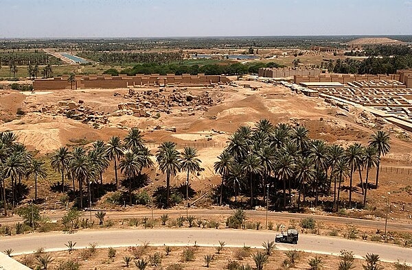 View from Saddam Hussein's former summer palace showing the ruins of ancient Babylon in the background. Photo courtesy of the US Navy/ Arlo K. Abrahamson.