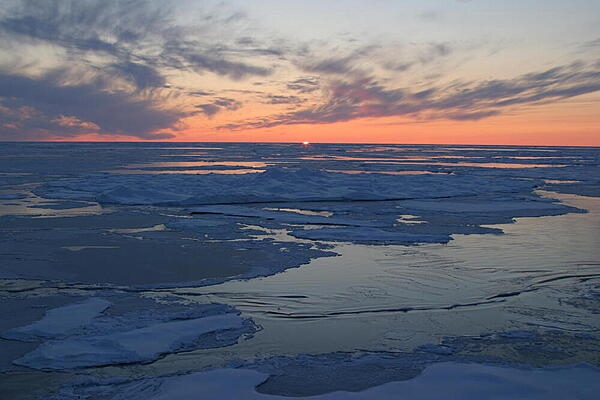Sunset over Arctic Ocean sea ice. Photo courtesy of the US Geologic Survey/ Jessica K. Robertson.
