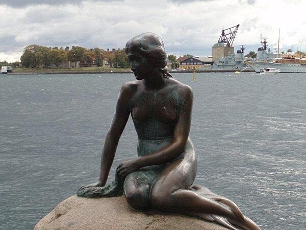 The Little Mermaid statue in Copenhagen Harbor has been a symbol of the city since 1913. Based on the fairy tale of the same name by Danish author Hans Christian Andersen, the small, unimposing, bronze statue has been damaged or defaced many times in the past half century, but has always been restored.