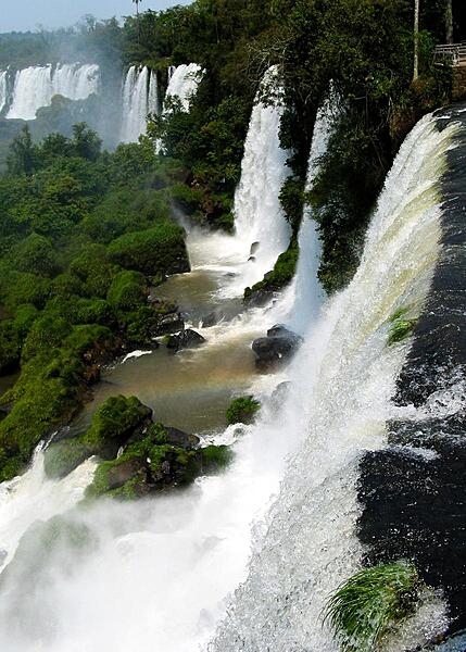 Iguazu Falls is located on the border between Argentina and Brazil. Approximately 2.7 km (1.7 mi) in width and reaching a maximum height of 81 m, about 2/3 of Iguazu Falls is in Argentina and 1/3 is in Brazil. This photo was taken from the Argentine side.