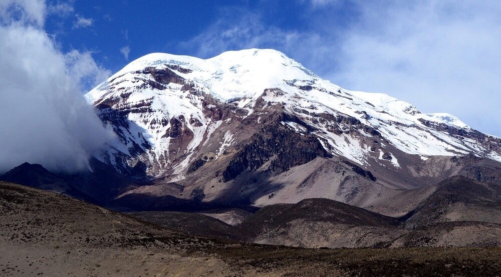 Mt. Everest is the world’s highest peak above sea level, but the highest point above the Earth’s center is the peak of Mt. Chimborazo located 150 km (93 mi) from Quito. The summit of Chimborazo is 6,268 m (20,564 ft) above sea level, but with the bulge near the Earth’s equator, the mountain is over 2,072 m (6797 ft) farther from the center of the Earth than Mt. Everest.