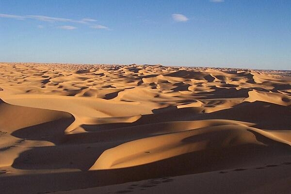 The Sahara Desert covers large parts of Algeria, Chad, Egypt, Libya, Mali, Mauritania, Morocco, Niger, Sudan, and Tunisia, with an area measuring approximately 9,200,000 sq km (3,600,000 sq mi). It is the largest hot desert in the world and the world’s third-largest desert, after Antarctica and the Arctic. The name "Sahara" comes from the Arabic word sahra meaning "desert.”