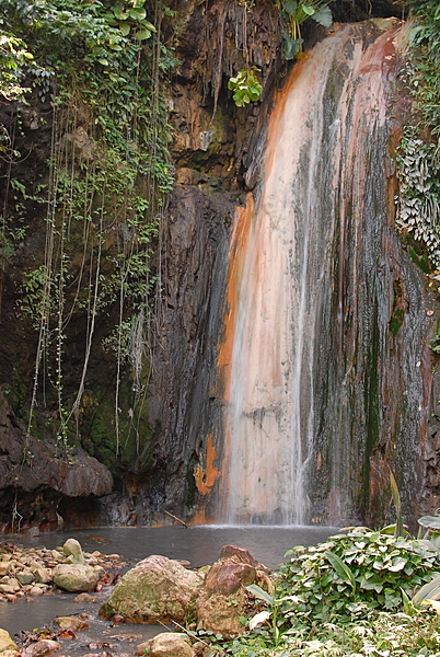 Diamond Falls - in Diamond Botanical Gardens - is colored by its mineral-laced waters.