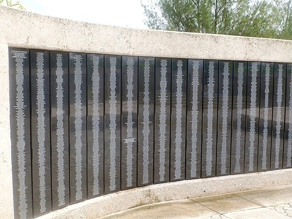 The Asan Bay Overlook Memorial Wall in Guam's War in the Pacific National Historical Park. The wall displays the names of 1,880 US servicemen who died in 1941 defending Guam against Japanese armed forces, as well as those who died retaking the island from Japan in 1944. Also listed are the names of the 1,170 Guam inhabitants who died and 14,721 who suffered war atrocities from 1941 to 1944. Photo courtesy of the US National Park Service.
