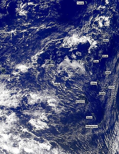Satellite photo showing most of the Marshall Islands archipelago. Majuro and Arno Atolls in the next image  lie to the lower right of this photo. Image courtesy of NASA.