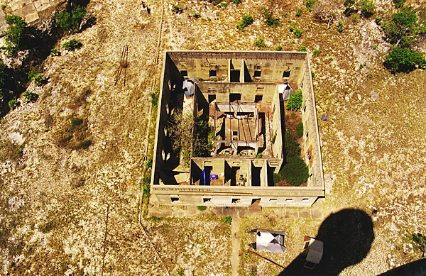 The ruins of Navassa Island's light keeper's quarters as seen from the lighthouse tower. Photo courtesy USGS.