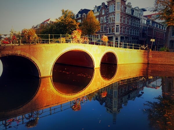 Amsterdam has 165 canals, but visitors are especially fond of the prominent ones in the city’s medieval center. Lined by 17th and 18th century houses, these canals form a half circle around the center of town. Development of the canals eventually drained the swampland of Amsterdam, allowing the development of a homogeneous urban area - the first model of large-scale town planning in the 19th century.