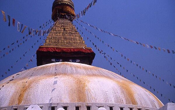 The eyes of Buddha gaze out over the dome of the Boudha in Kathmandu.