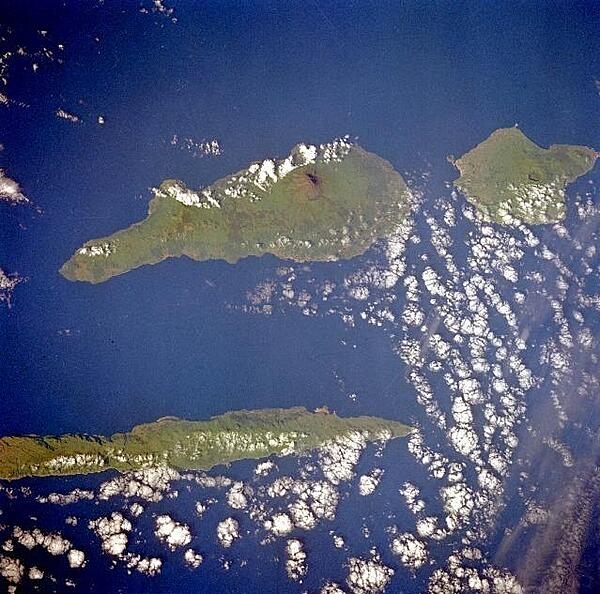 Three islands of the central Azores - spear-shaped Sao Jorge Island, Pico Island with its large volcano, and circular volcanic Faial Island - are visible in this low-oblique, southwest-looking, space shuttle photograph. Image courtesy of NASA.