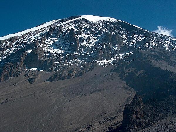 Mt. Kilimanjaro in Tanzania, Africa’s highest mountain and the world’s tallest freestanding volcano, is 5,895 m (19,341 ft) high. The origin of its name supposedly is a combination of the Swahili word kilima meaning “mountain” and the KiChagga word njaro, loosely translated as “whiteness” giving the name “White Mountain.” Mt. Kilimanjaro became a UNESCO World Heritage Site in 1987 and a Natural Wonder of Africa in 2013.