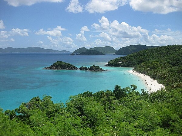Trunk Bay is a beautifully sited locale on the island of Saint John and one of the most photographed places in the Virgin Islands. The bay has an underwater trail for snorkeling along its coral reef. Image courtesy of the US Geological Survey.