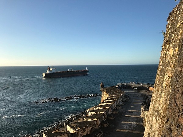 A ship crossing the entrance to San Juan Bay. From the 1500s to today, all ships entering or exiting the bay must pass in front of the mighty walls of the Castillo San Felipe del Morro. Photo courtesy of the US National Park Service/ Casey Ogden.
