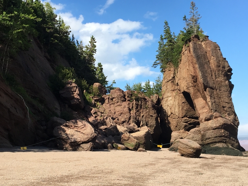 The Bay of Fundy between the provinces of New Brunswick and Nova Scotia, Canada, is home to the highest recorded tides on Earth, which can seasonally exceed 15 m (50 ft). On the western shore of the bay, Hopewell Rocks are sandstone conglomerates eroded by the rapidly shifting tides. At low tide, the formations are viewable from the beach.