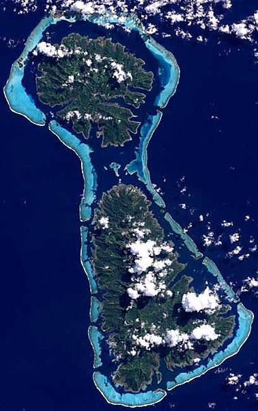 The islands of Taha’a and neighboring Raiatea to the immediate south are enclosed by the same coral reef; they may once have been a single island. Image courtesy of NASA.