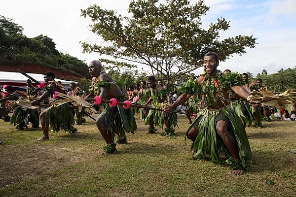 Fijians perform a traditional dance on Vanua Levu on 17 June 2015 for the crew of the hospital ship USNS Mercy (T-AH 19) as part of a ceremony during Pacific Partnership 2015. US and Fijian engineers worked together to build a new classroom at the Viani Primary School and celebrated with a ribbon cutting ceremony. Photo courtesy of the US Navy/ Chief Mass Communication Specialist Christopher E. Tucker.
