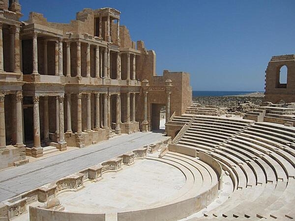 The amazingly well-preserved Roman theater at Sabratha, in northwestern Libya on the Mediterranean Sea (visible in the distance). Although Libya is not often associated with ancient Rome, much of the north African Mediterranean coastal area was incorporated into the Roman Empire in the first century B.C. Sabratha was an important commercial port city during the early centuries A.D. and made its fortune as a terminus of the trans-Saharan caravan routes. The historic Sabratha site was restored by archaeologists in the 1920s and 1930s and declared a UNESCO World Heritage Site in 1982.