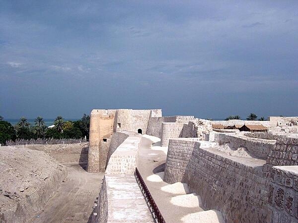 Walls of the historic Qal&apos;at al-Bahrain (Fortress of Bahrain), which is the largest and most ancient historical site in the country. It was an important center of the Dilmun Civilization (2nd and 1st millennia B.C.); in later periods, it served as a trading and military outpost.