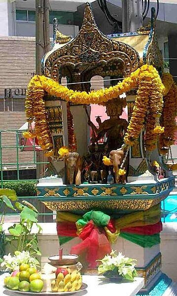 A spirit house in front of the Chateau de Bangkok Hotel.