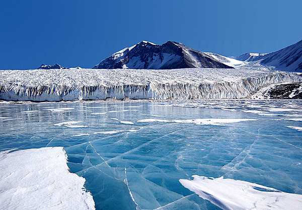 The blue ice covering Lake Fryxell, in the Transantarctic Mountains, comes from glacial meltwater from the Canada Glacier and other smaller glaciers. Image courtesy of National Science Foundation.